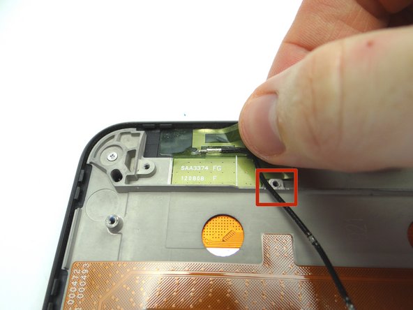 Lay the cable next to the screw socket as pictured.