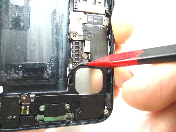 Picture 1: Use the pointed tip of the Black Spudger to pry the cellular antenna connector from its socket.