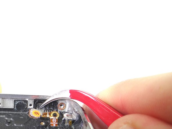 From COMPARTMENT D, use tweezers to replace the mute switch.  The pictures show the correct orientation.