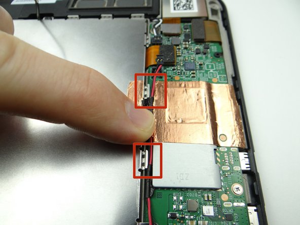 Picture 2: Seat the cable speaker next to the notches (red squares) on the outside edge of the battery frame.