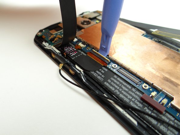 Open LCD ZIF connector with blue pry tool.