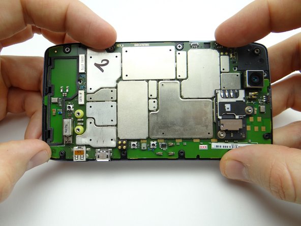 Pictures 2 &amp; 3: Lower logic board into place.