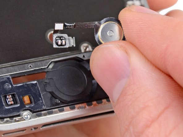 Pick up the home button from COMPARTMENT G (or replacement part) and carefully guide through the mid-frame.