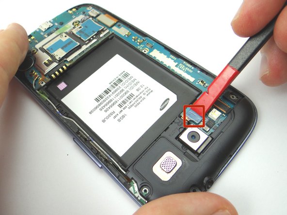 Picture 1: Use the Black Spudger to release the headphone jack/speaker assembly cable.