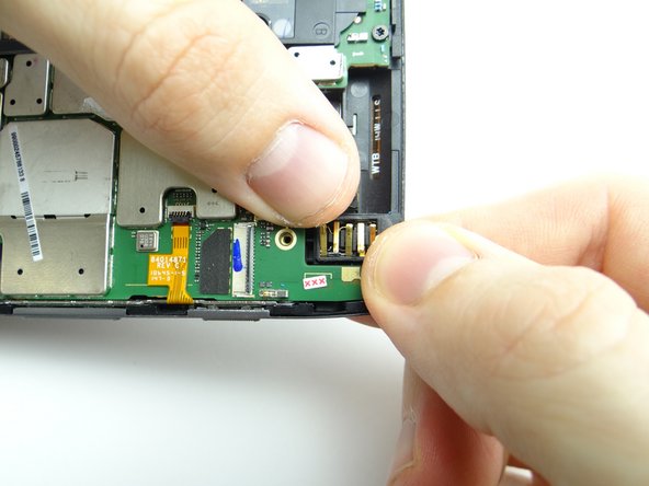 From COMPARTMENT D, retrieve headset jack.  Use your fingers to place it as shown.