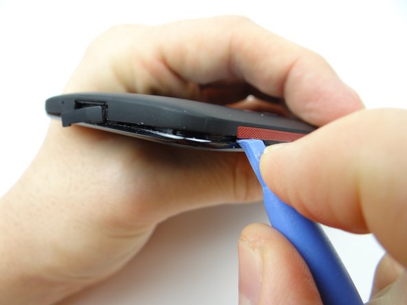 Picture 2: Slowly work your way around the corner gently prying up as you go.