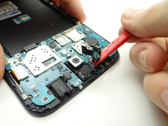 Finish removing the assembly with the flat end of the spudger and place it in COMPARTMENT C.