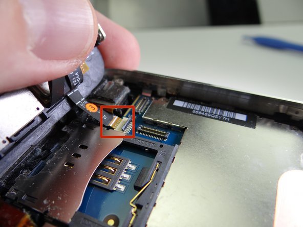 Use your thumb to gently guide the ribbon cable out of the ZIF connector.