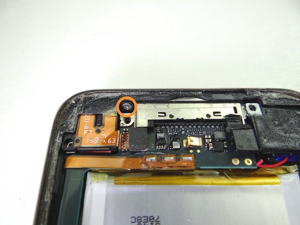 Seat the cable connector and replace the 2.6 mm Phillips screw from SLOT 9.