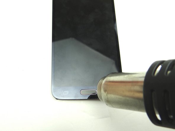 Picture 1: Heat the top side of the home button with low-level 100° Celsius heat for 30 seconds.