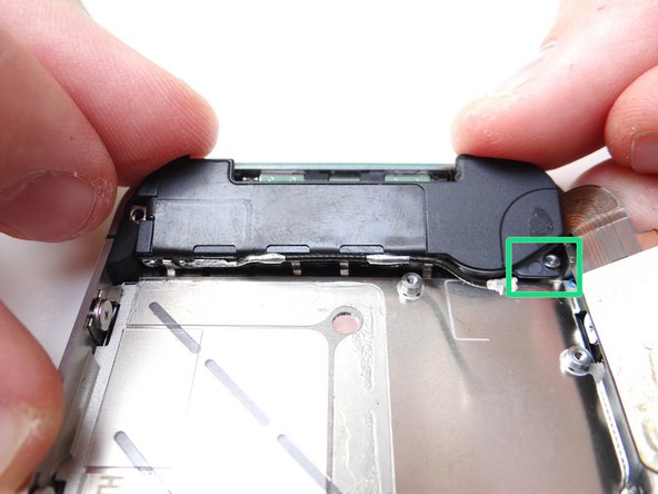Grab loudspeaker assembly from COMPARTMENT E (or replacement part) and place it inside mid-frame.  Push the front of the assembly (with the clips) down first, then push the entire assembly into place.