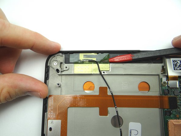 Use pointed end of spudger to peel up corner of antenna gel tape.