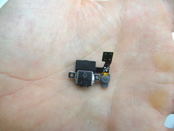 Picture 2: Guide the headphone jack and microphone up and away from the mid-plate.