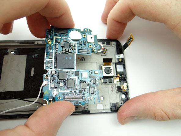 Picture 3: Move the logic board away from the top of the phone and over the battery holding area.
