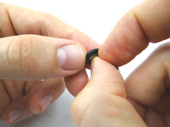 Separate the ribbon cable contact from the home button.