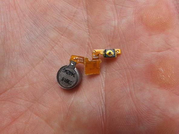 Replace the vibrator and power button cable from COMPARTMENT E.