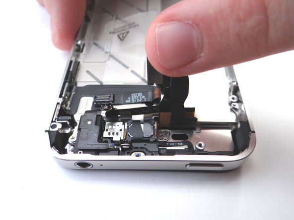Picture 2: Carefully guide the display cables back through the slot on the mid-frame while lowering the mid-frame onto the display assembly.