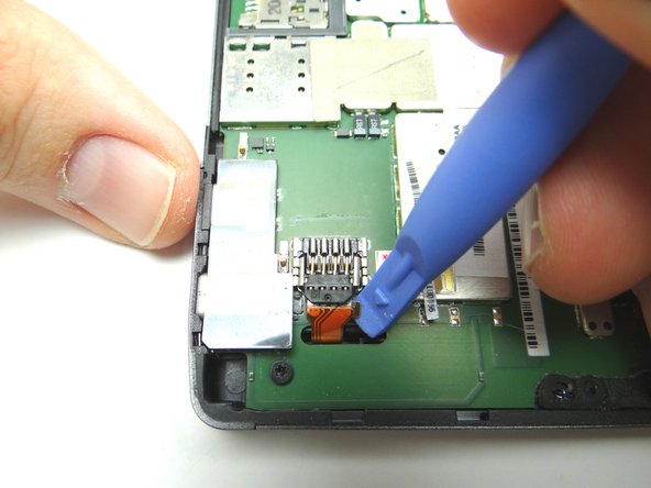 Lift the battery connector into the upright position.