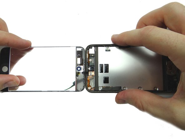 Don't separate the two halves as the digitizer cable is still attached to the logic board.