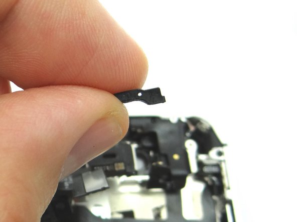 Use Curved Tip Tweezers to replace the metal bracket, from COMPARTMENT E, covering the Sensor Cable.