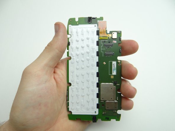 Lift the logic board away from the front panel and place it in ZONE IV.