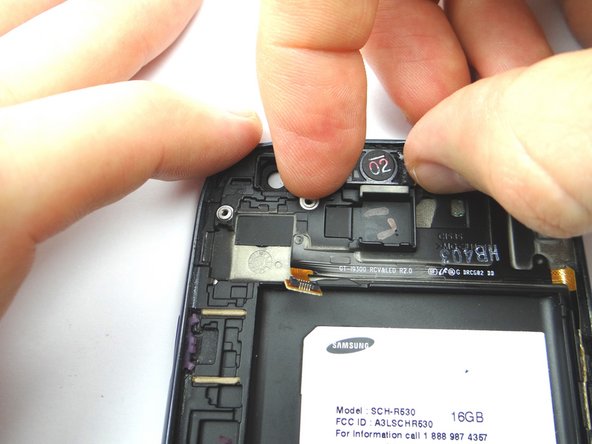 Use your fingers to position the earpiece speaker into its spot.