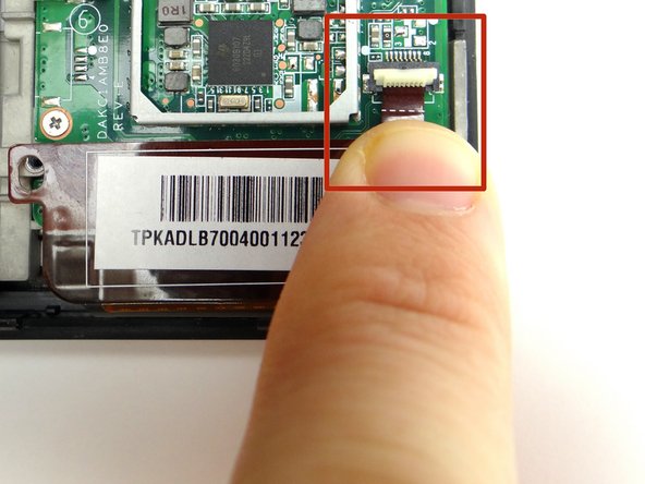 Picture 2: Slide the digitizer cable connector out with your finger.