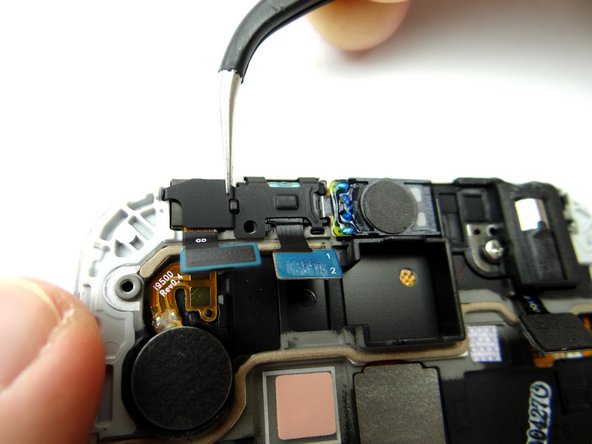 Use the Curved Tip Tweezers to replace the metal plate from SLOT 4.