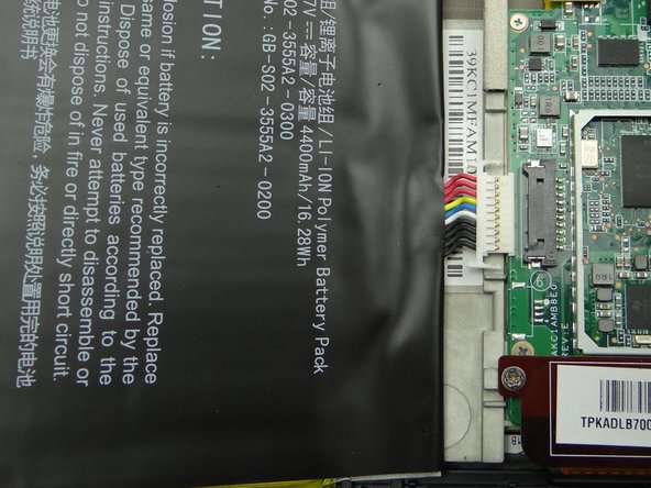 Seat the battery from ZONE V while guiding the battery connector into its socket.