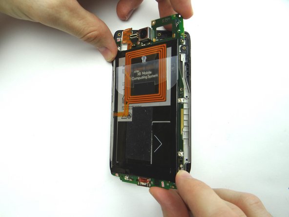 Picture 3: Continue opening the right side of the logic board away from the display assembly like a book until it reaches nearly a 90 degree angle.