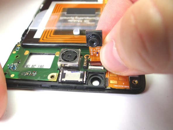 With the ZIF connector open, pull the front-facing camera free.