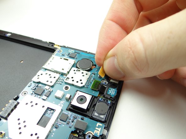 Pick up the camera with your fingers.  Place front-facing camera in COMPARTMENT C.