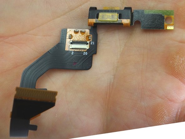 Picture 2: Continue peeling up the speaker and cable assembly up with both hands until free.