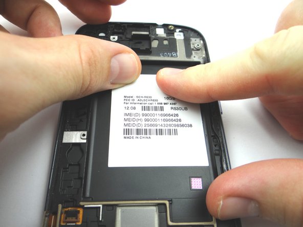 Place the IMEI sticker on the new display assembly and smooth out with your fingers.