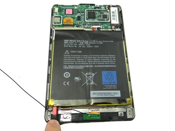 Picture 1: Wedge the spudger under the lower-left corner of the battery as shown.