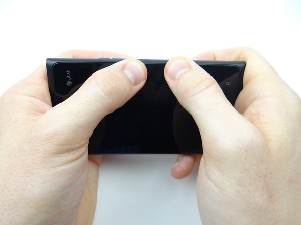 Squeeze the buttons side into place.