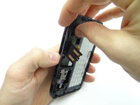 Guide the display cable assembly through the opening on the keyboard assembly as you continue separating the keyboard assembly from the front panel.