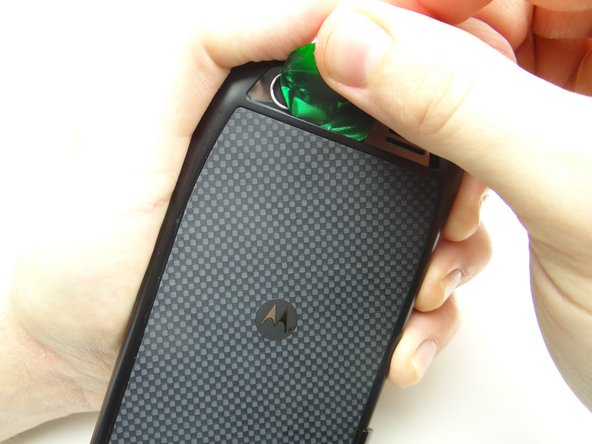 Picture 2: Release clips behind the charging and HDMI ports.