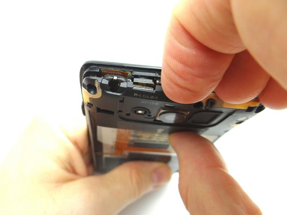 Pull the top panel free with your fingers.