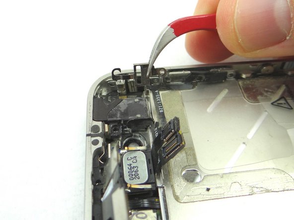 Picture 1: Remove the mute switch bracket with Curved Tip Tweezers. Place into SLOT 14.