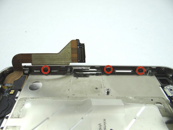 Picture 2: tighten the three large-head Phillips screws along the left side of the iPhone.