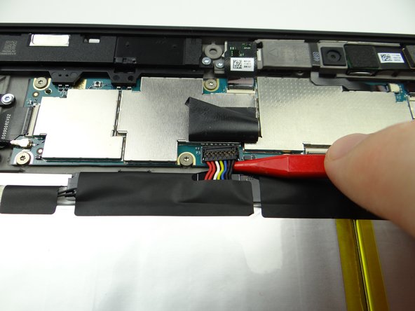 Leave tape connected to the logic board as shown.