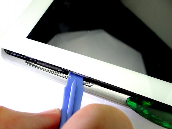 Picture 2: Work your way up to the speaker.  Insert a guitar pick an inch below the speaker.