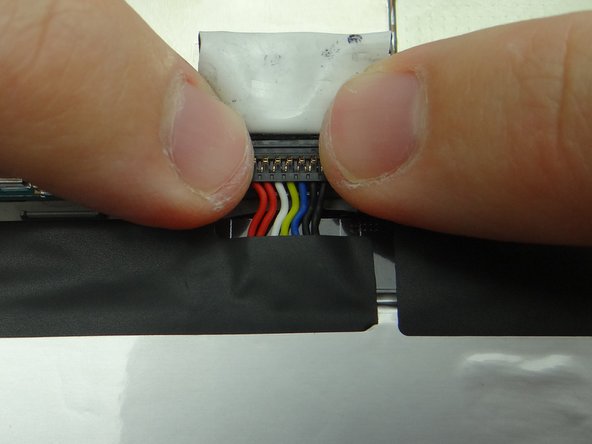 Push battery connector straight down into its socket on the logic board.