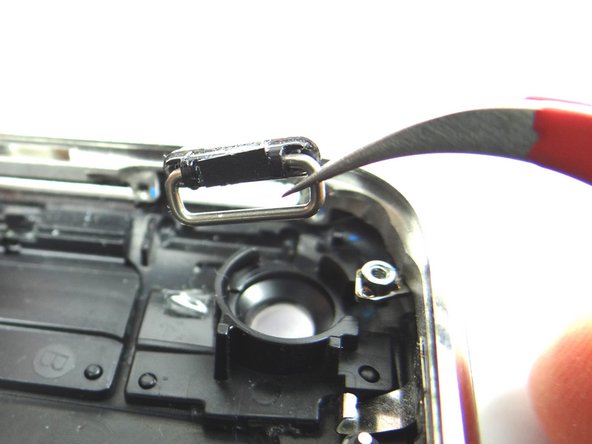 From COMPARTMENT C, use curved-tip tweezers to place the power button.