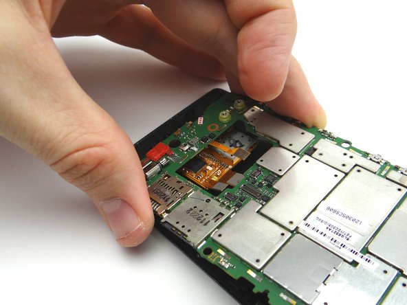 Picture 2: Lift the bottom of the logic board slightly and pull it away from the three display cables to free it.  Once the logic board is free, place it in ZONE V.