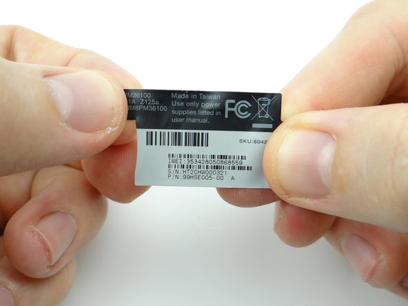 Retrieve the IMEI sticker from compartment D.  Seat the sticker as shown.