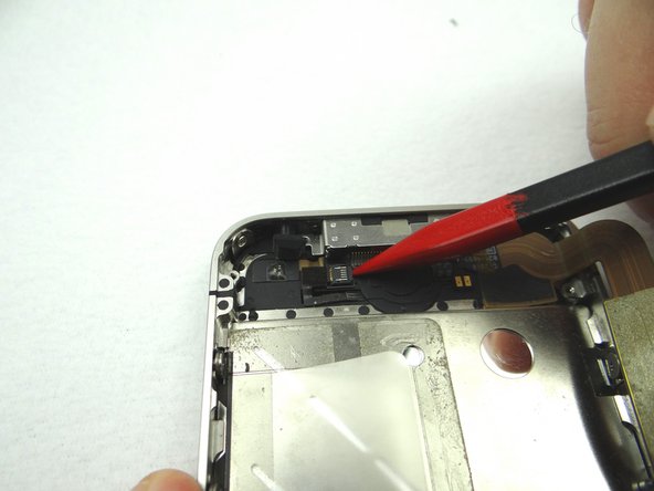 Picture 3: Use the pointed edge of the Black Spudger to flip the ZIF connector to the &quot;closed&quot; position.