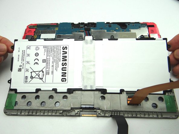 The battery lifts easily up and away from the tablet.  Place battery in ZONE V.