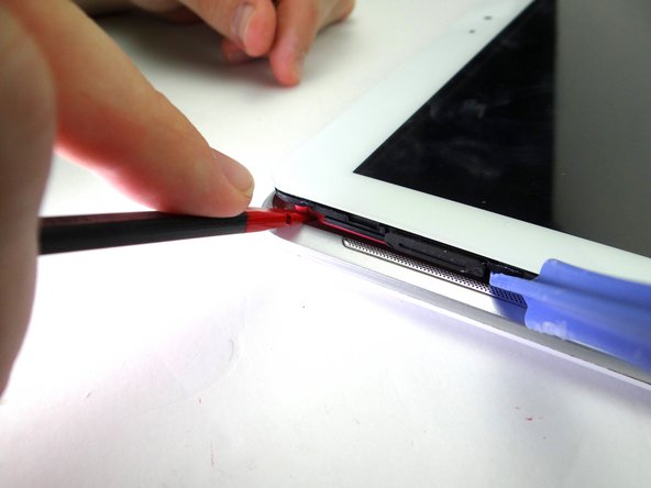 Picture 1: Use spudger to pry up upper-left corner under the pink speaker.